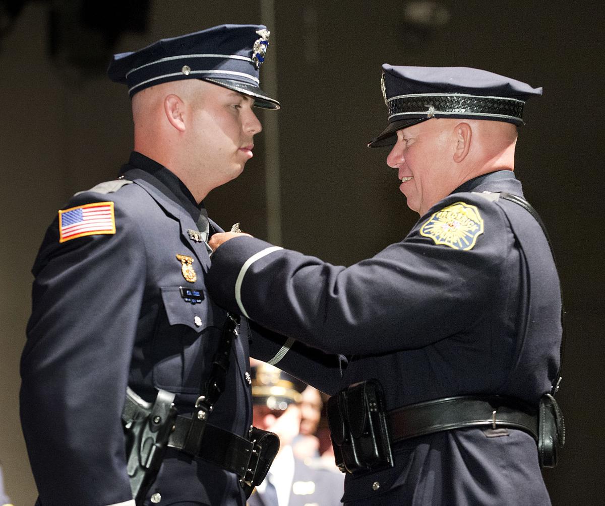 56th police academy graduates take the oath