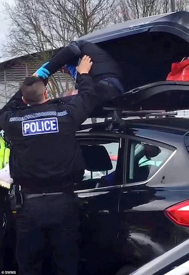 Police break open locked car roof box at M25 service station to find ...